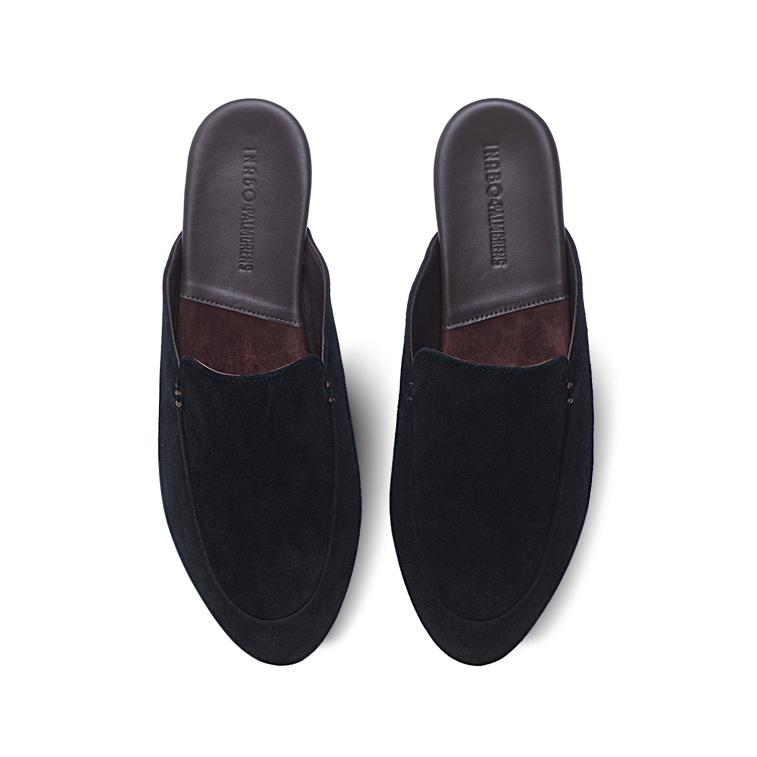 Black suede slippers with brown footbed